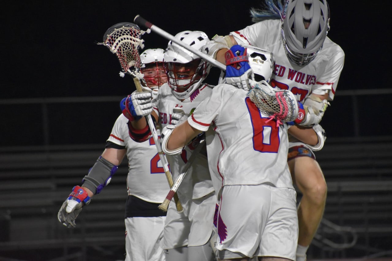 Lacrosse team celebrating together