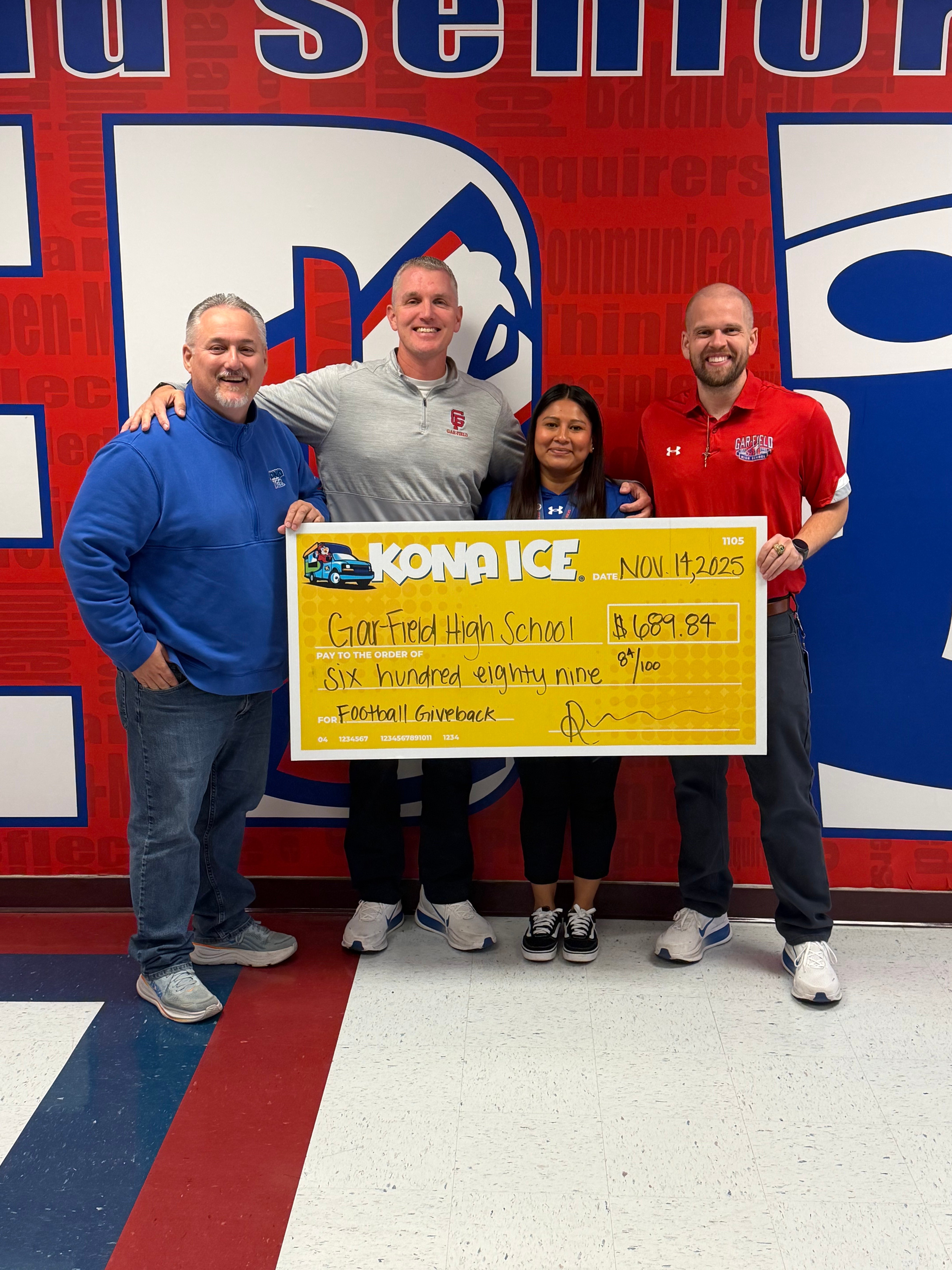 DSA Mr. Payne, ADSA Mr. Miller, AA Ms. Campos and Kona ICE rep holding a donation check
