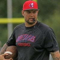 Picture of Coach Edmunds with a whistle in his mouth