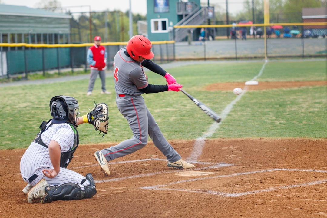 Baseball player hitting a baseball