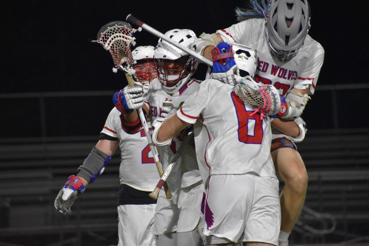 Lacrosse team celebrating together